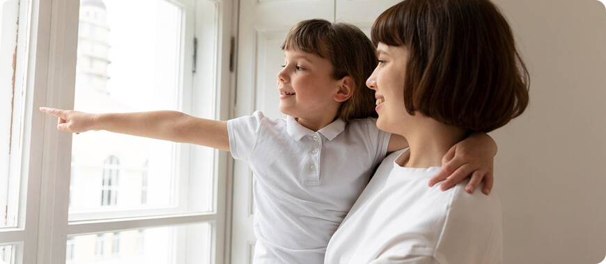 Parent and child playing 'What's Happening?' at the window, practicing Present Continuous