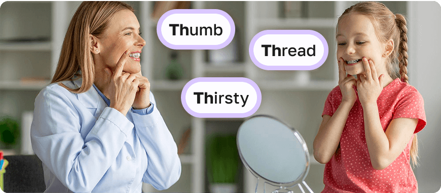 Practicing the 'TH' Sound Together A woman and a child standing in front of a mirror, both smiling and touching their mouths as they practice the 'TH' sound by pronouncing words 'Thumb' 'Thread' 'Thirsty'